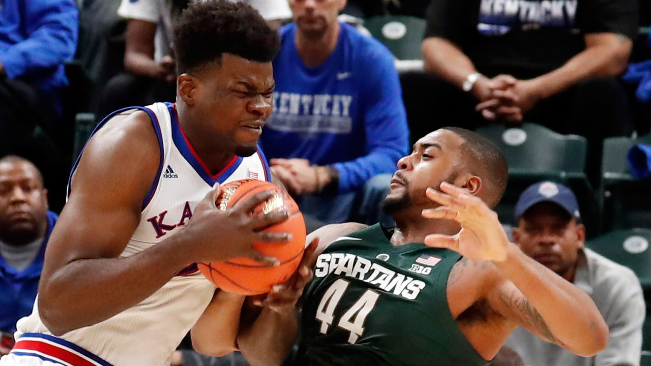 No. 1 Kansas holds off No. 10 Michigan State 92-87